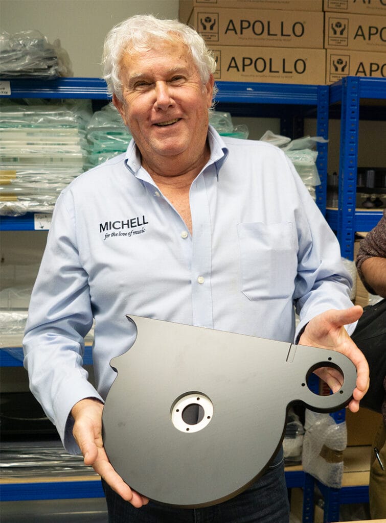 Stephen Rowland holding a Michell chassis